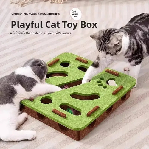 Playful cat toy box with interactive holes and treats, engaging two cats on striped rug